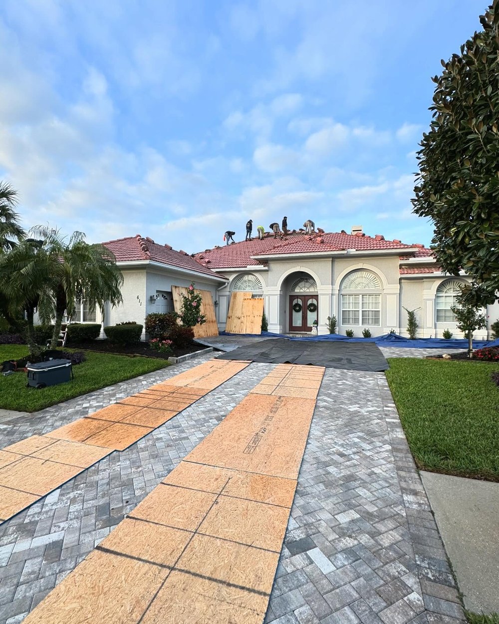 Hunter Construction crew replacing a tile roof